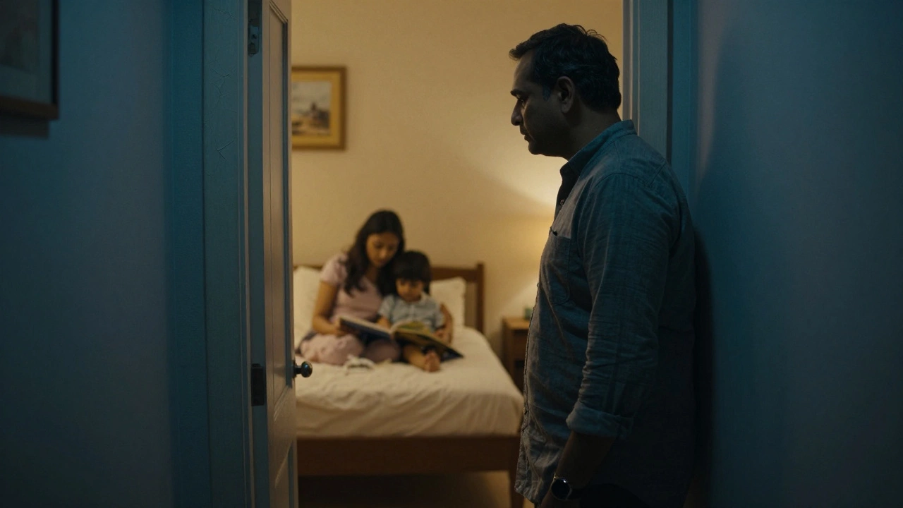 A father watching his child and mother from a distance through a doorway.